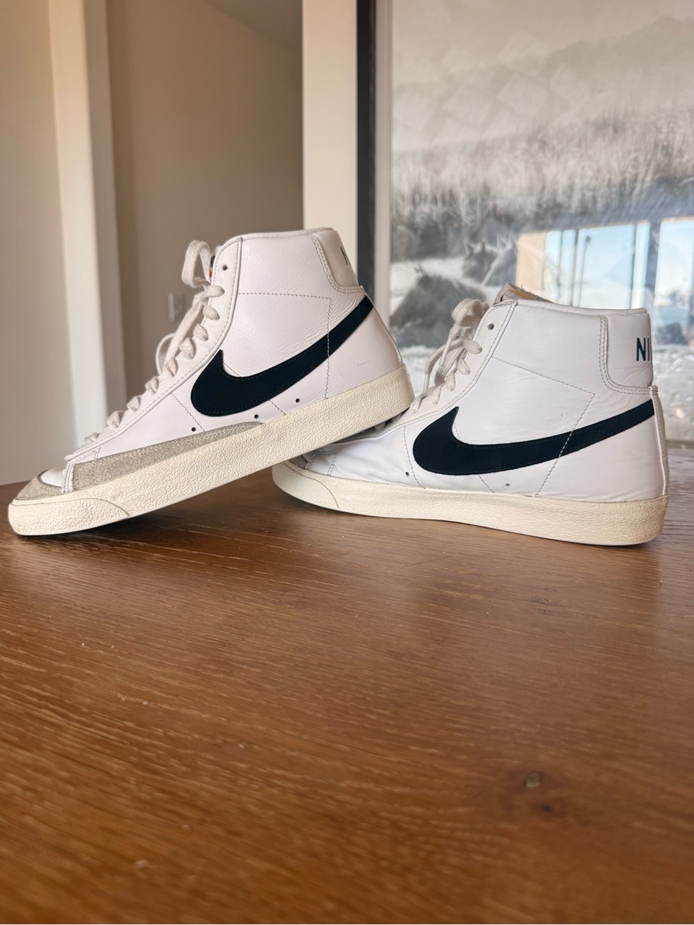 Nike White High-Top Sneakers with Black Swoosh